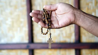 Rosary in hand