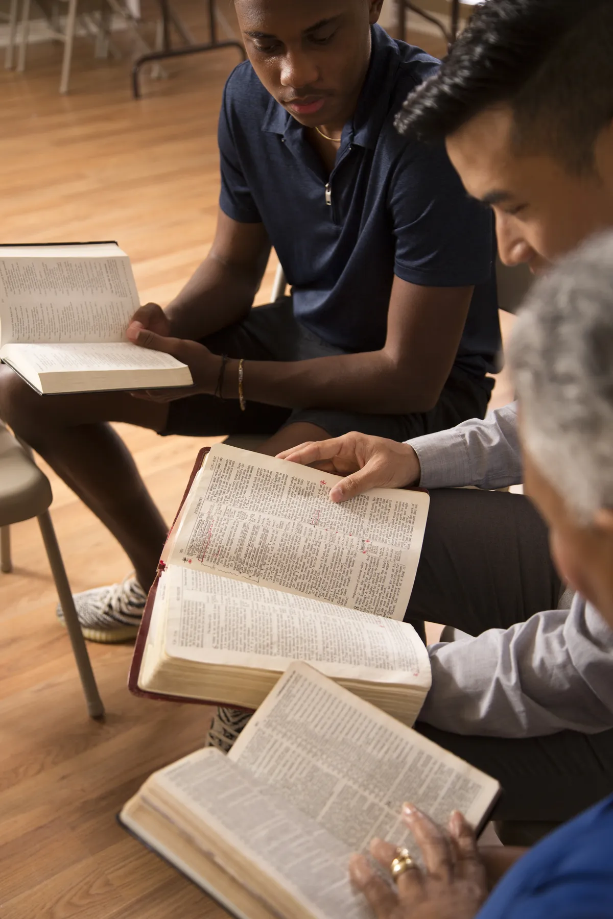 Multi Ethnic Group of friends meet for a Bible Study